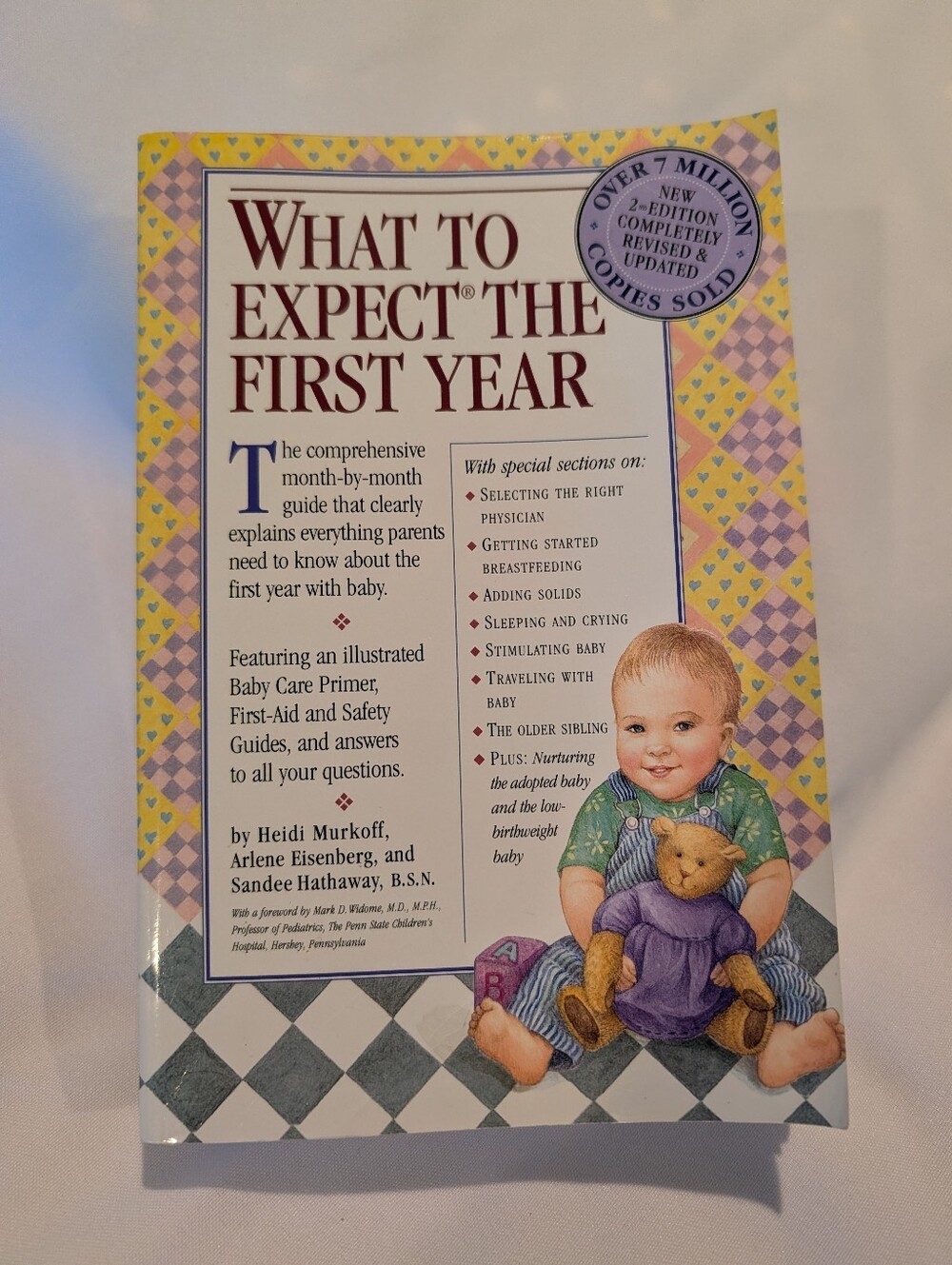 What to Expect the First Year - Baby Care Guide (Yellow / Purple)